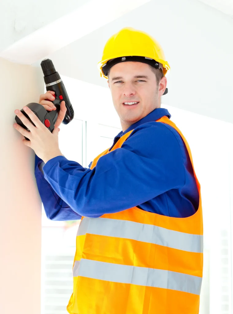 attractive-young-worker-holding-tool-standing-ladder
